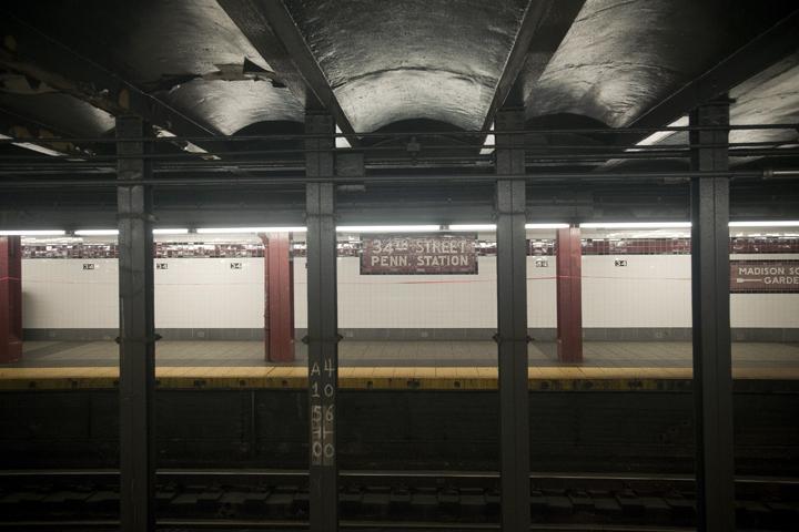 Weekend service cuts leave a New York City subway station empty