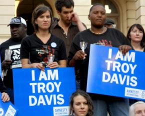 Supporters at a vigil stand in solidarity with Troy Davis