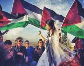 Love in a Time of Apartheid activists celebrate a mock wedding at the Hizma checkpoint