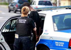Boston police arrest a young Black man